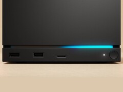 Vista frontal de la Steam Machine de Valve con dos puertos USB, un puerto USB-C, un LED de encendido, un botón de encendido redondo y una tira de LED azul. (Fuente de la imagen: Valve)