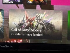 Captura de pantalla del panel de control de Xbox que muestra un anuncio de Call of Duty: Mobile en el que aparecen mechs Gundam con la leyenda 