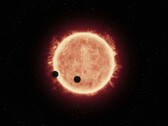 Una ilustración que muestra una estrella y dos planetas.
