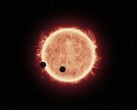 Una ilustración que muestra una estrella y dos planetas.