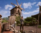 Una imagen en la que aparecen un agricultor y un molino en «Medieval Dynasty».