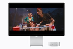 La imagen muestra el nuevo Mac mini M6 junto a una pantalla Studio. Se está reproduciendo algún tipo de vídeo.