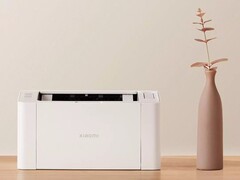 La impresora láser Xiaomi K100 tiene un tamaño similar al de una cara de papel A4. (Fuente de la imagen: Xiaomi)