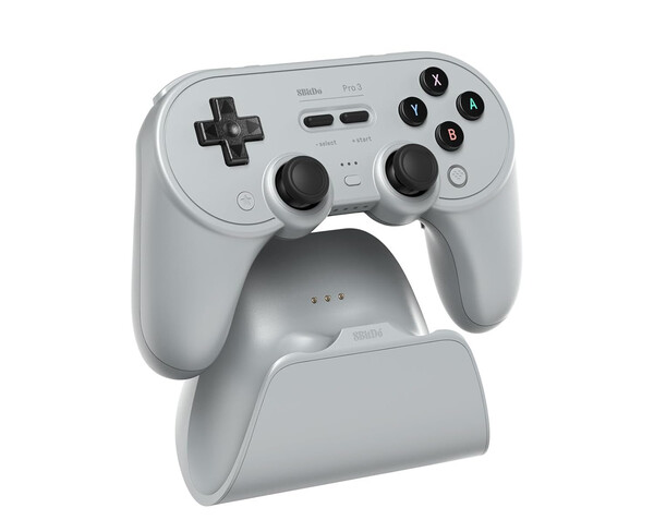 El 8BitDo Pro 3 viene con una base de carga que aloja el adaptador de 2,4 GHz. (Fuente de la imagen: 8BitDo)