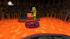 Croc Legend of the Gobbos captura de pantalla que muestra a Croc saltando sobre la lava