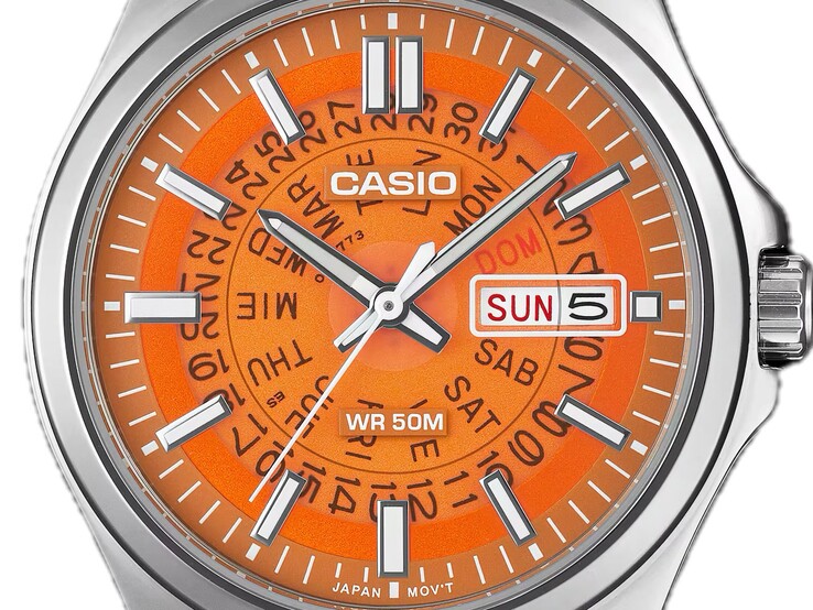 Un primer plano del MTP-E740-4AV de color naranja, con su esfera transparente que deja ver las ruedas del día y de la pantalla situadas debajo.  