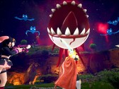 Captura de pantalla de Palworld que muestra a los personajes luchando contra un globo ocular flotante con dientes afilados