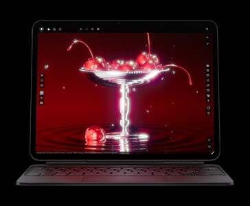 Apple iPad Pro M5 con Magic Keyboard mostrando un render 3D de cerezas, mostrando la pantalla Ultra Retina XDR OLED y los gráficos del chip M5 (Fuente de la imagen: Apple)