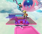 Captura de pantalla de Popucom con personajes sobre plataformas en las nubes resolviendo rompecabezas