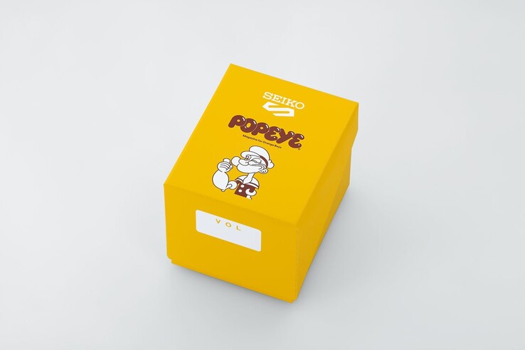 Caja de presentación amarilla de edición especial para el Seiko 5 Sports x Popeye HDB013, con el logotipo de Popeye y diseños conmemorativos del aniversario.