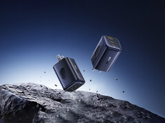 El nuevo PicoGo 67 W AE11 cuesta 39,99 dólares. En la imagen: Una imagen promocional del cargador rápido flotando en el aire sobre rocas. (Fuente de la imagen: Baseus)