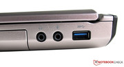 Uno de los tres puertos USB 3.0, entrada de cascos y micrófono (3.5 mm)