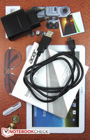 ... un cable micro-USB, un conector de corriente auxiliar y una guía de inicio rápido.