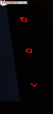 Las habituales teclas táctiles bajo la pantalla brillan en rojo...