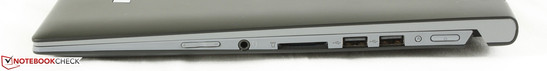 Derecha: control de volumen, combo de audio de 3.5 mm, lector SD 2-en-1, 2x USB 2.0, botón Lenovo OneKey, encendido