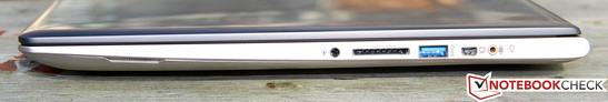 Derecha: clavija de auriculares, lector de tarjetas, USB 3.0, Mini VGA, conexión para el subwoofer