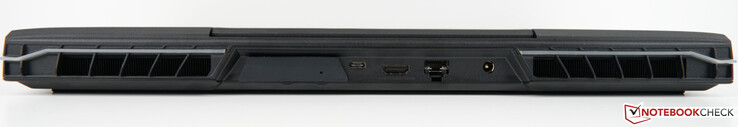 Parte trasera: Ranura para XMG OASIS (con tapa), USB-C 3.2 Gen 2×1 (DisplayPort 1.4a), HDMI 2.1 (compatible con G-SYNC, HDCP 2.3), puerto RJ45 2,5 Gb/s (LAN), adaptador de CA